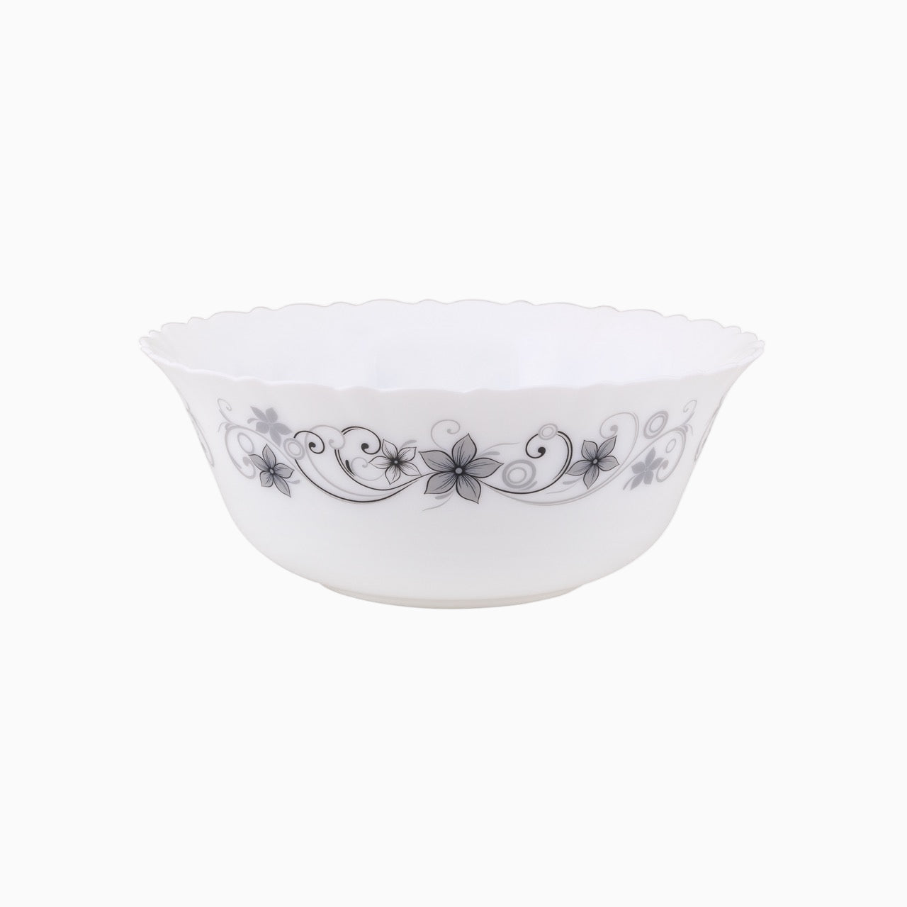 A set of white dinnerware with a floral pattern, including plates, bowls, and mugs.