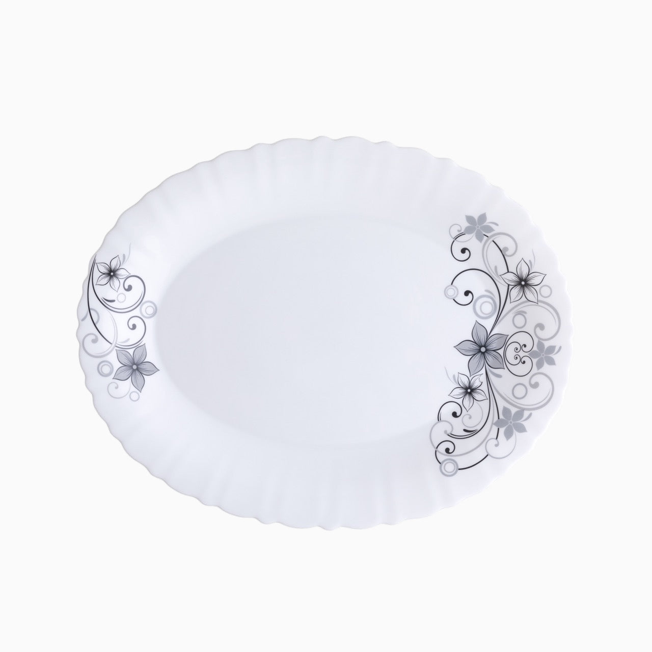 A set of white dinnerware with a floral pattern, including plates, bowls, and mugs.