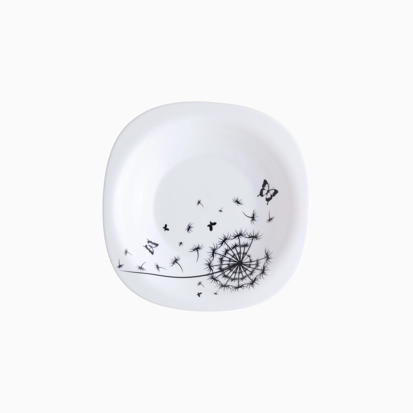 White soup plate with black dandelion and butterfly design on a white background