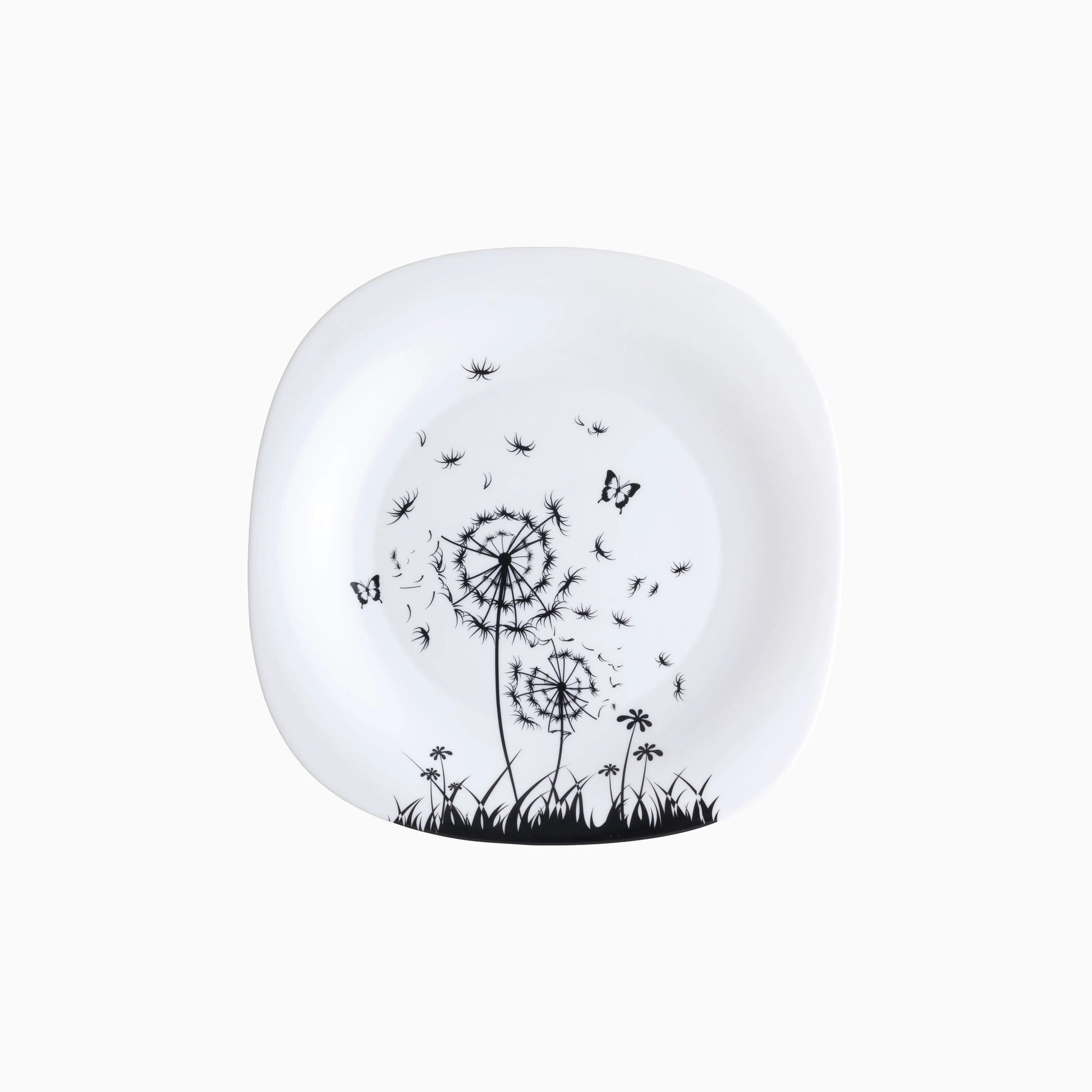 White plate with black dandelion and butterfly design on a white background