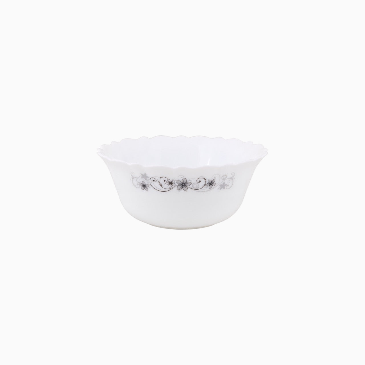 A set of white dinnerware with a floral pattern, including plates, bowls, and mugs.