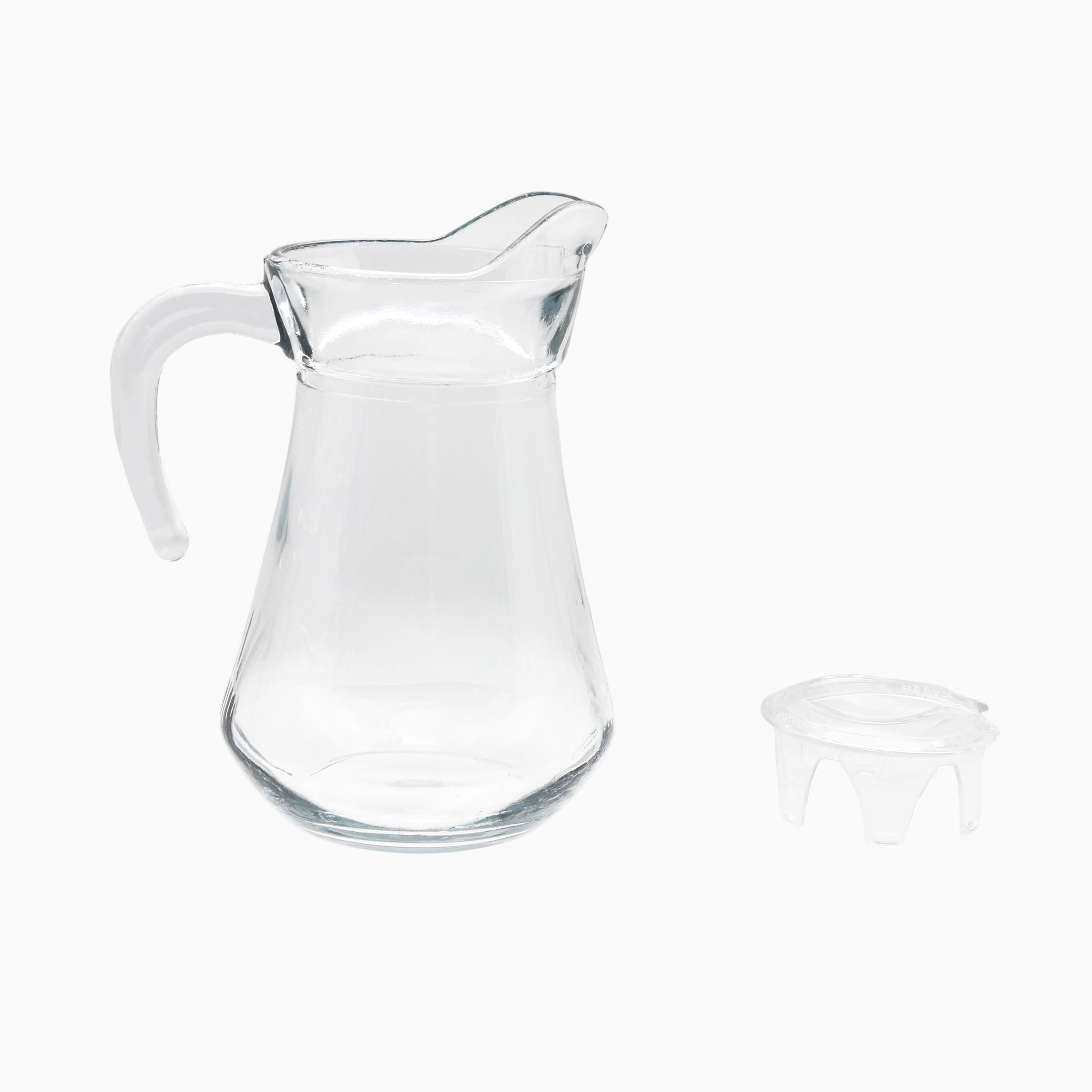 Clear glass pitcher with a small lid on a white background