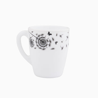 A set of white dinnerware with black floral patterns, including plates, bowls, and a platter dish.