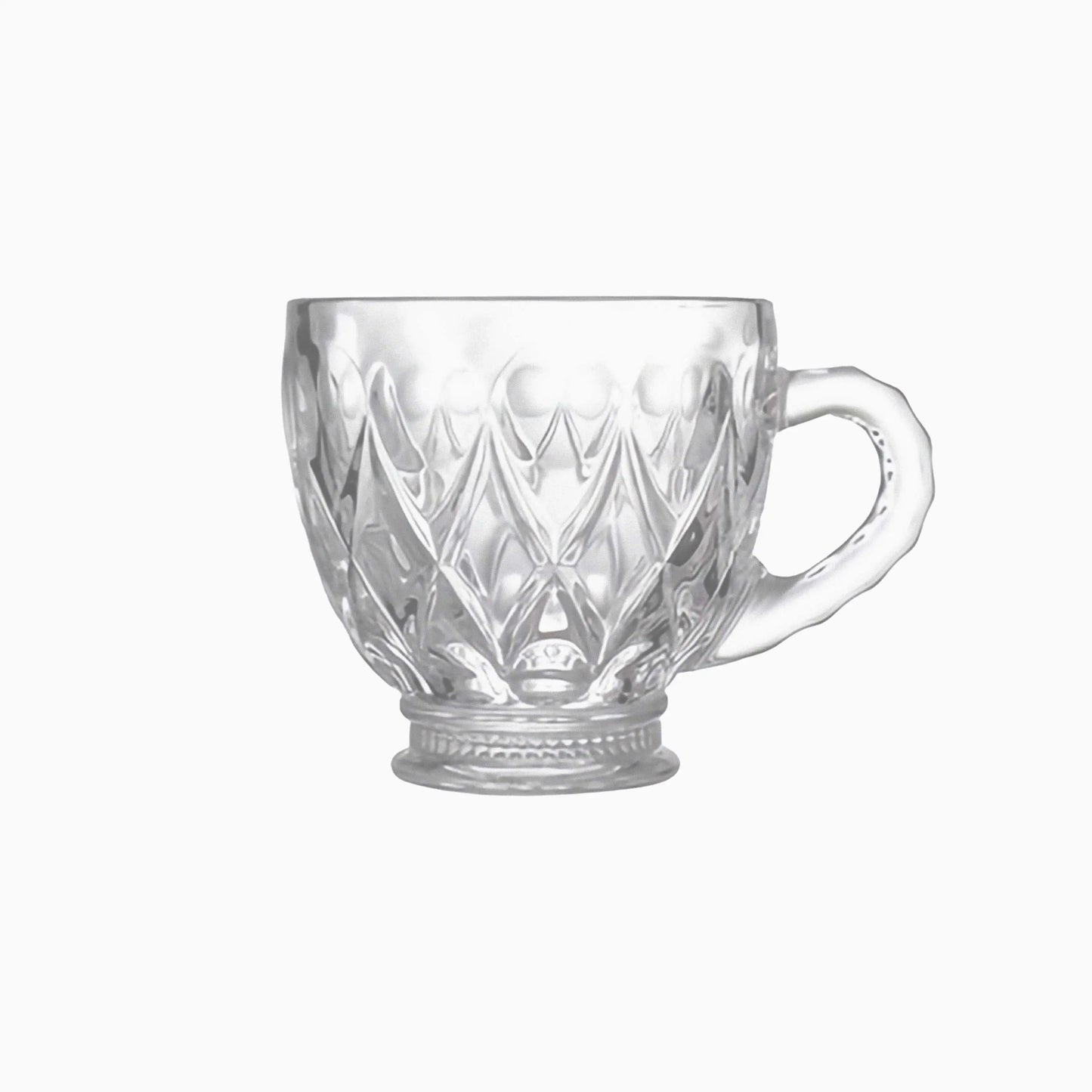 Clear glass mug with diamond cut pattern on a white background