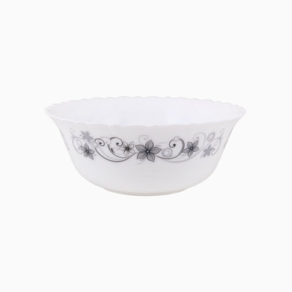 A set of white dinnerware with a floral pattern, including plates, bowls, and mugs.