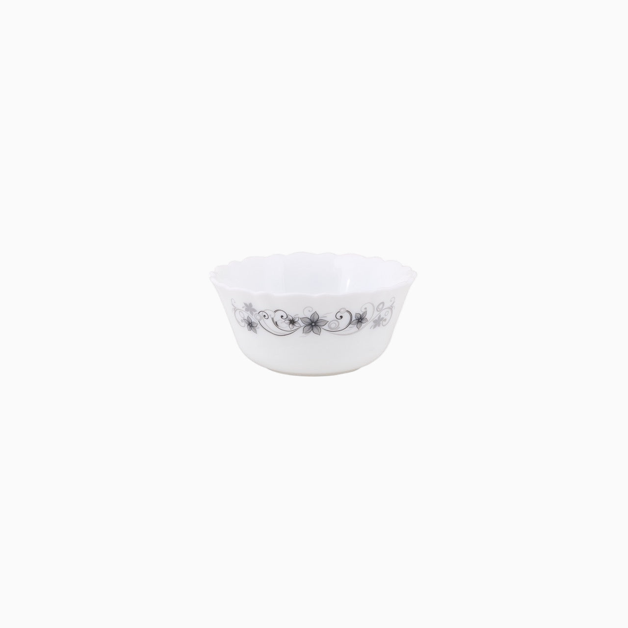 A set of white dinnerware with a floral pattern, including plates, bowls, and mugs.