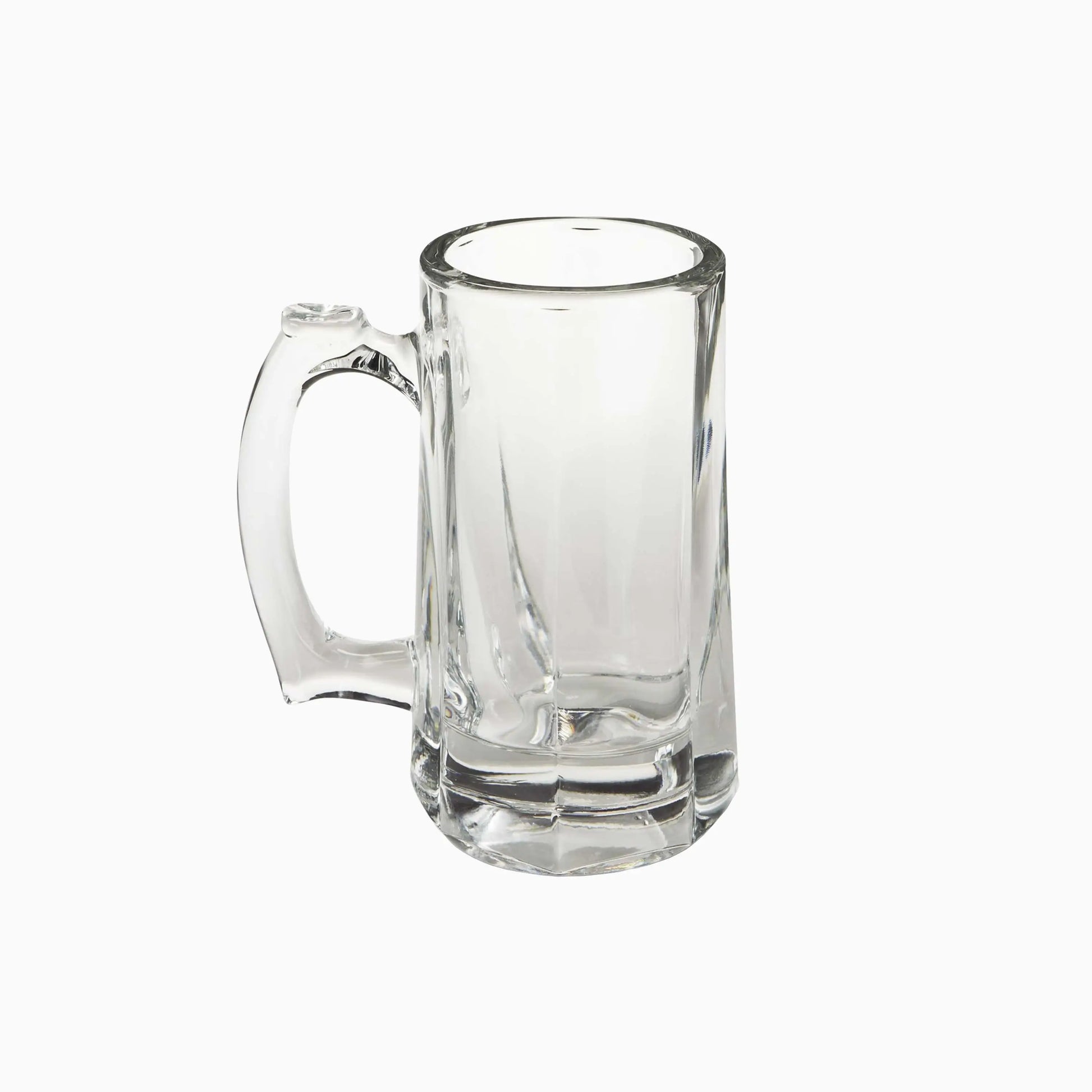 Clear glass mug with handle on a white background