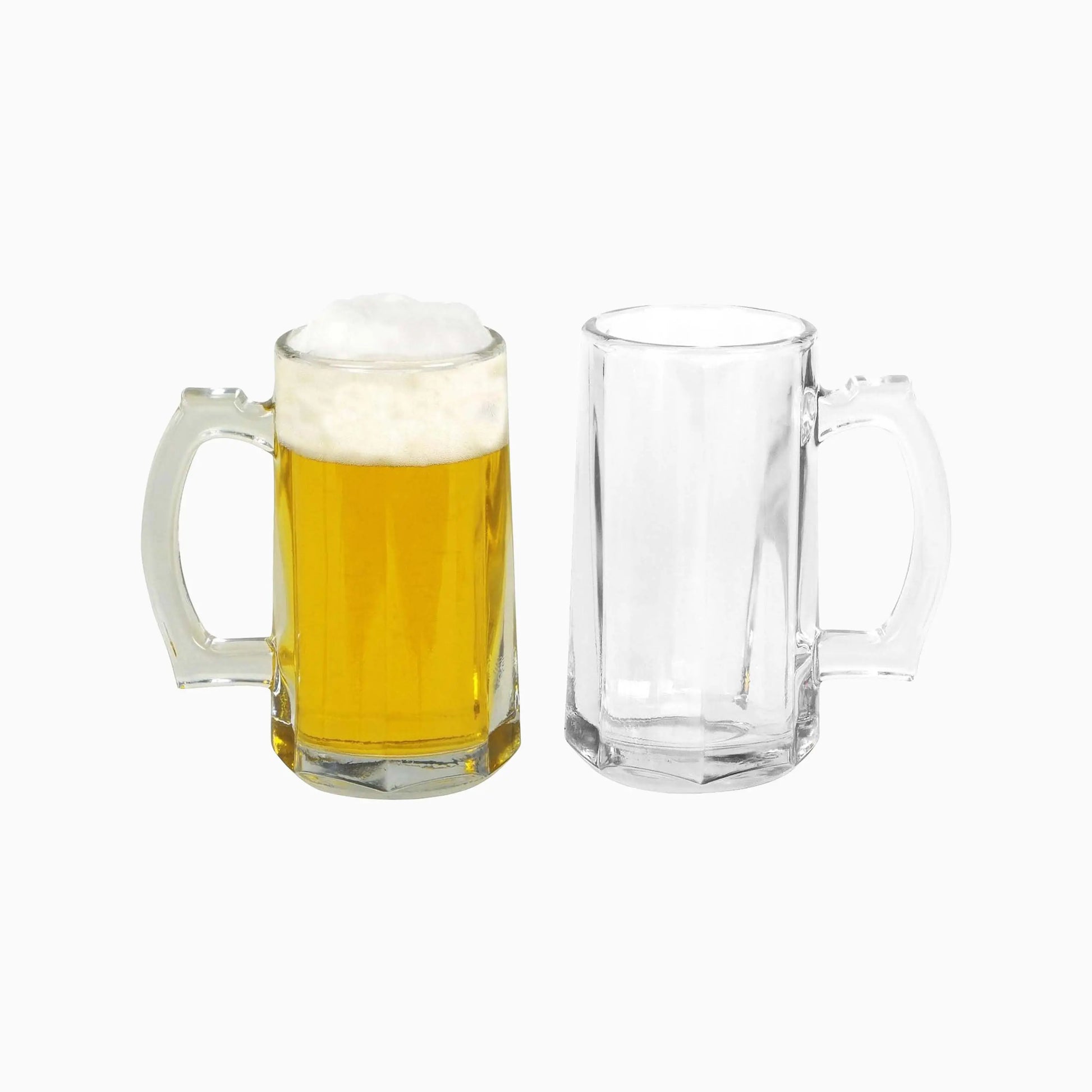 Two glass mugs, one filled with beer and the other empty, on a white background.