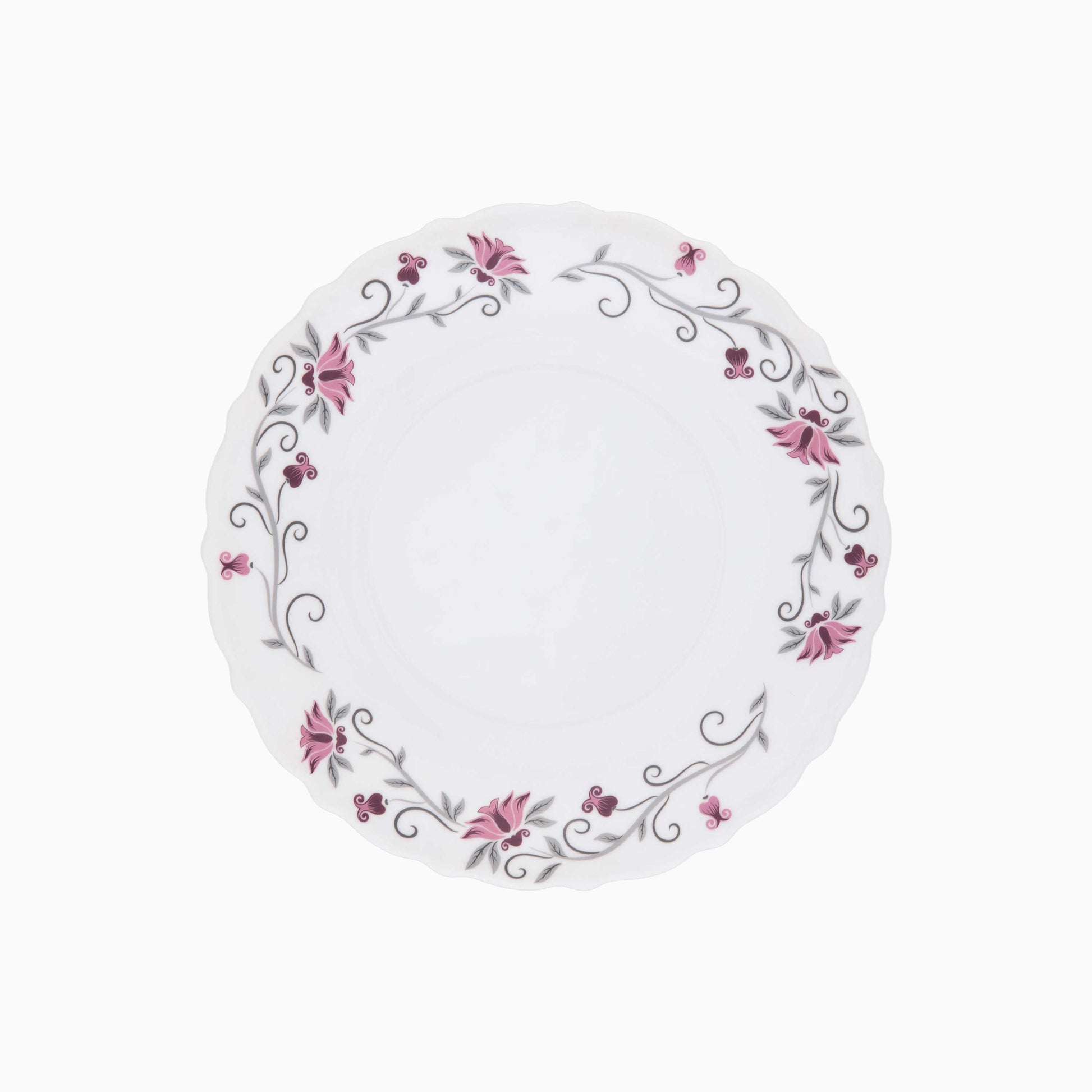 Round white plate with floral design on a white background