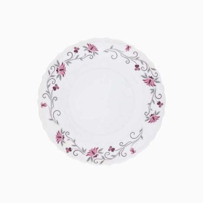 Round white plate with floral design on a white background