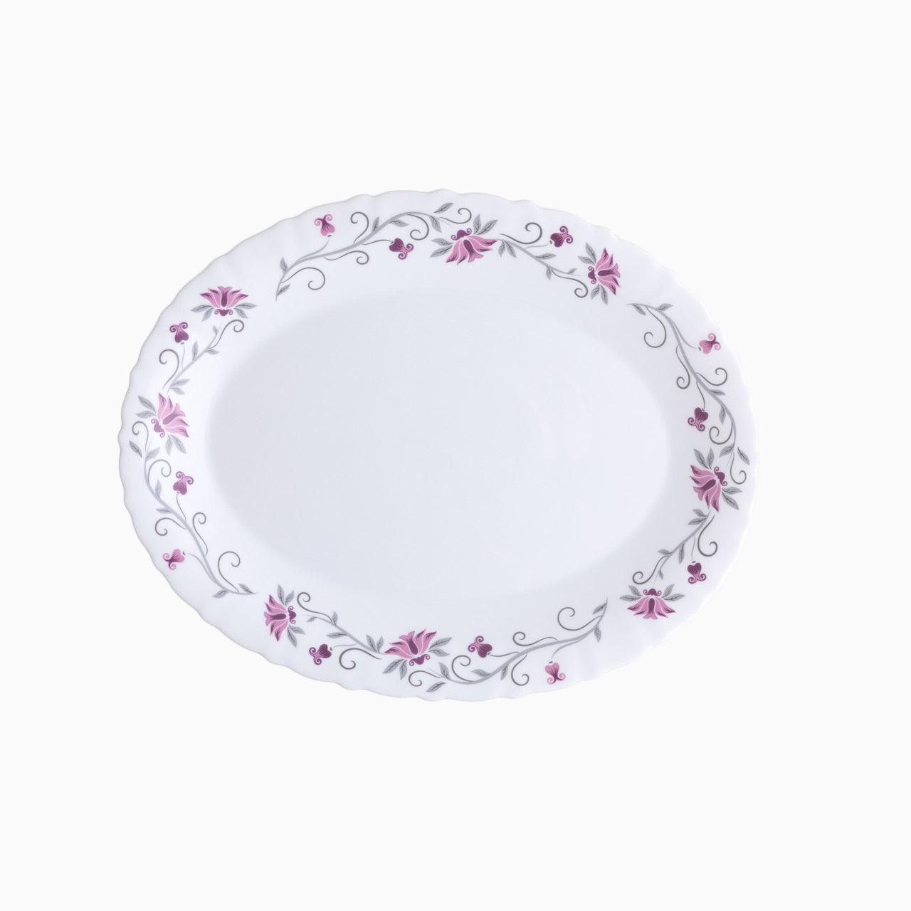 A set of white opal dinnerware with a floral pattern around the rim, including plates and bowls.