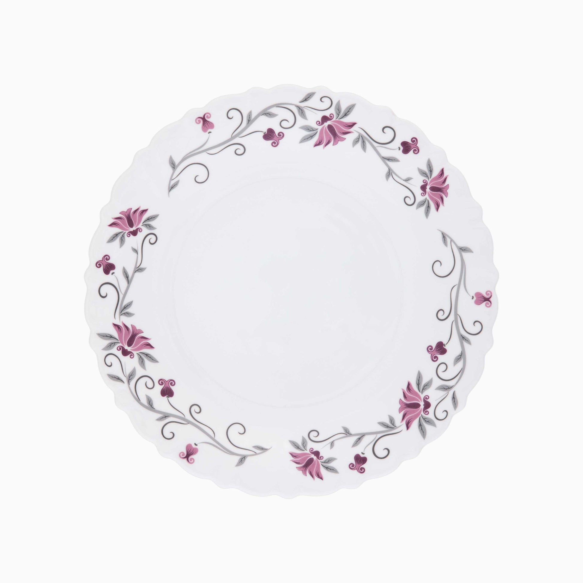 Round white plate with floral design on a white background