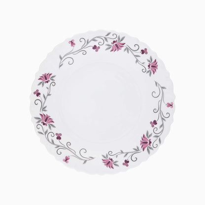 Round white plate with floral design on a white background