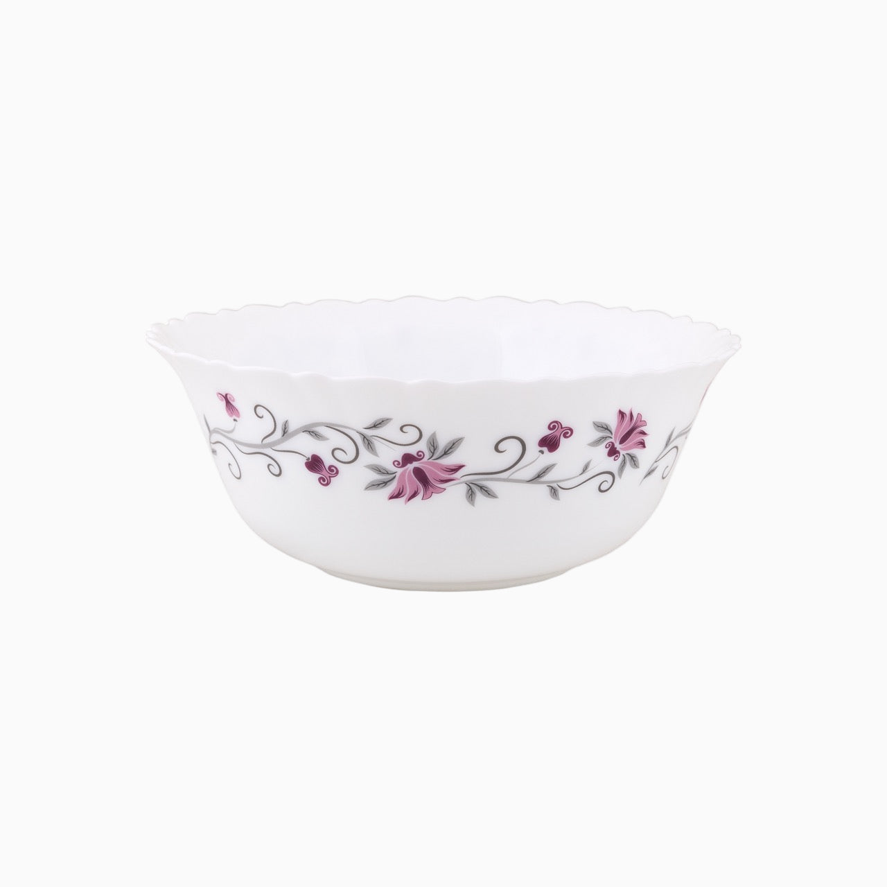 A set of white opal dinnerware with a floral pattern around the rim, including plates and bowls.