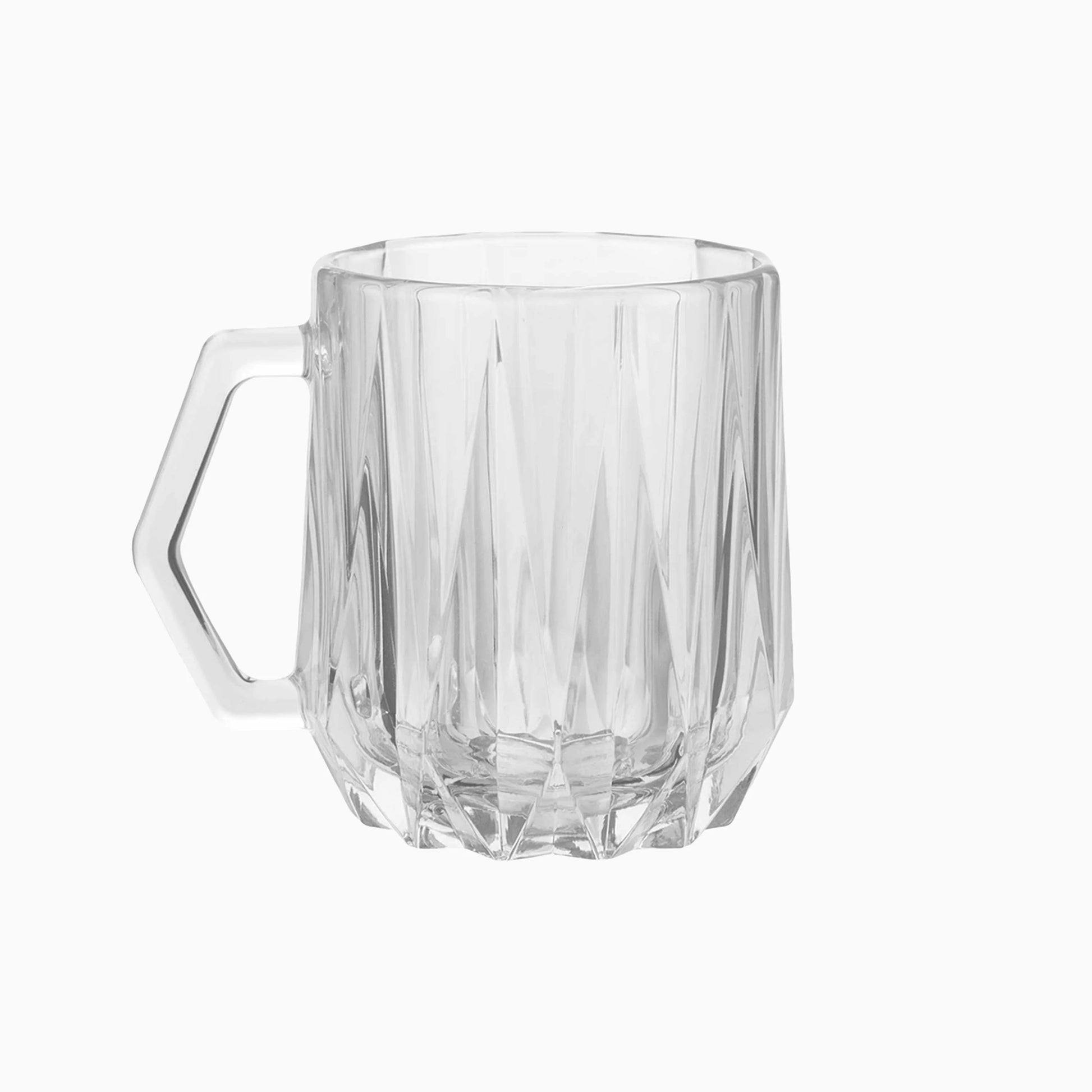 Clear glass mug with textured design on a white background