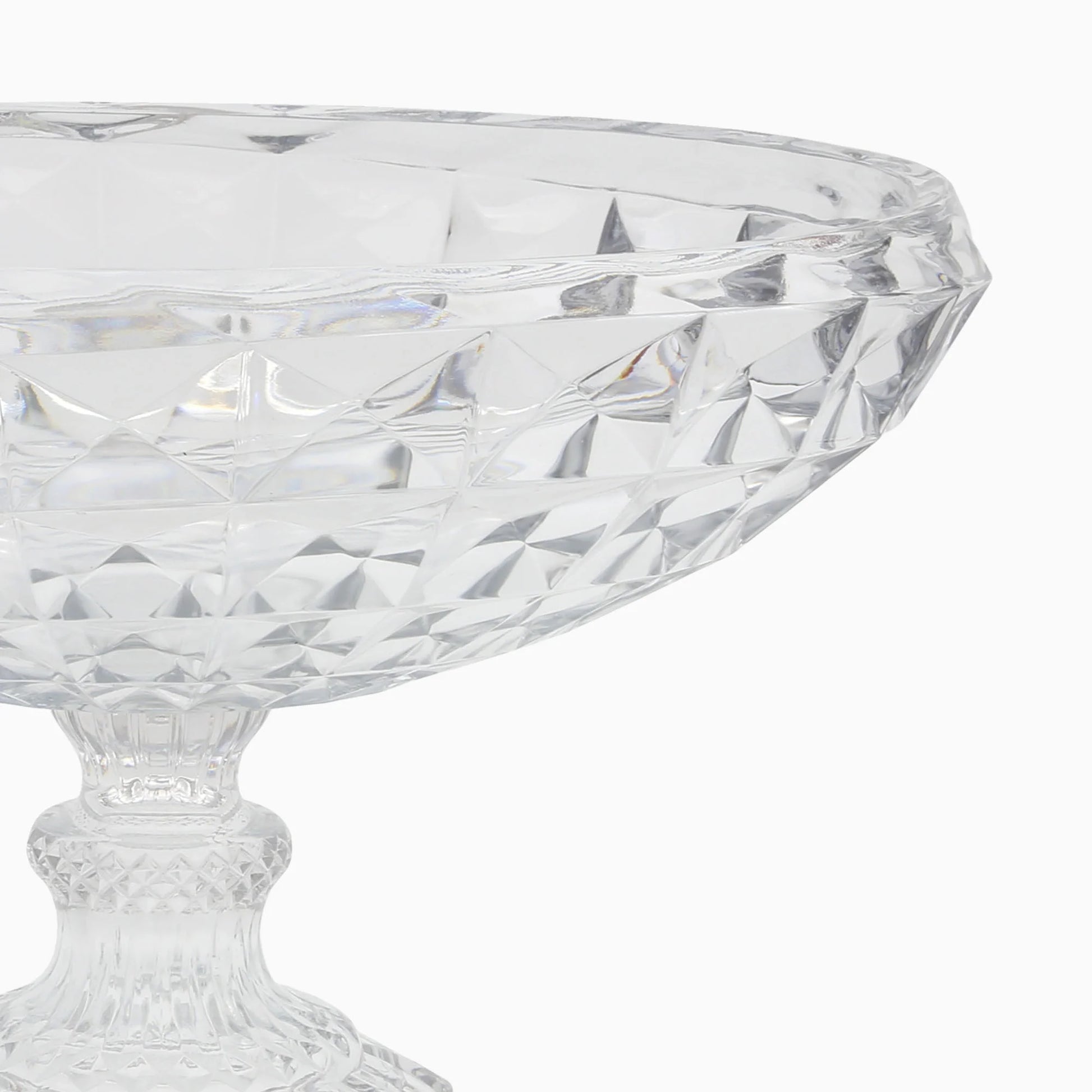 Clear glass bowl with diamond cut pattern on a white background