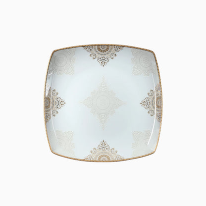 Square ceramic plate with decorative gold patterns on a white background