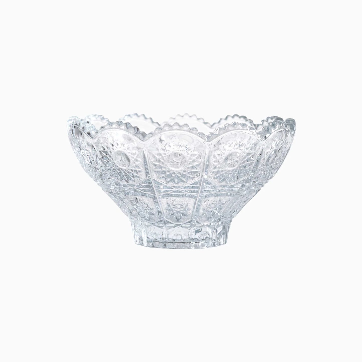 Clear glass bowl with decorative pattern on a white background