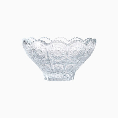 Clear glass bowl with decorative pattern on a white background