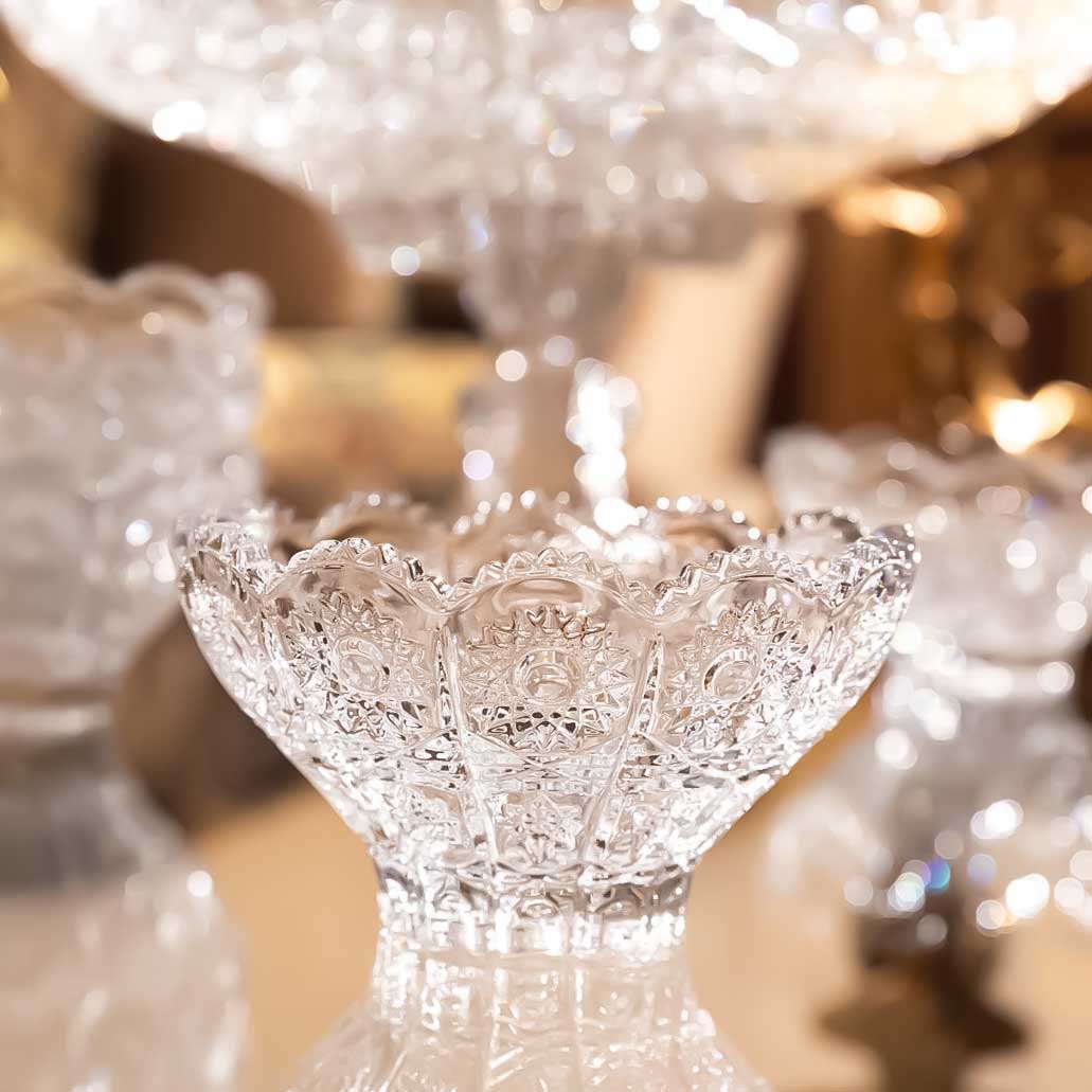 Decorative crystal bowl with intricate designs on a blurred background