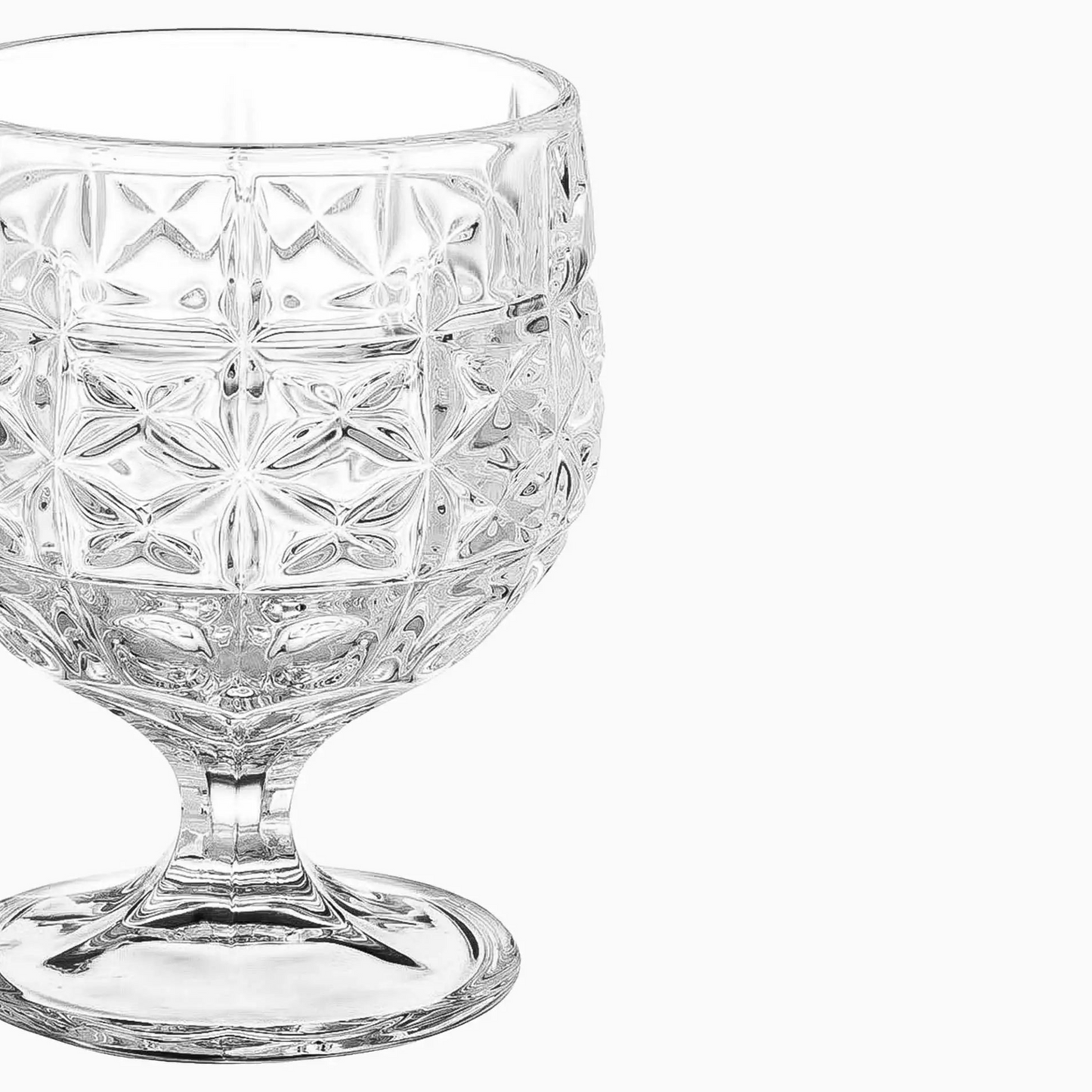 Clear glass with diamond cut pattern on a white background