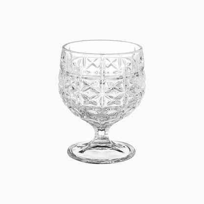 Clear glass with diamond cut pattern on a white background