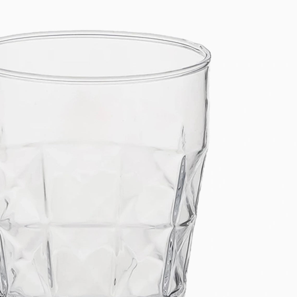 Clear glass with textured design on a white background