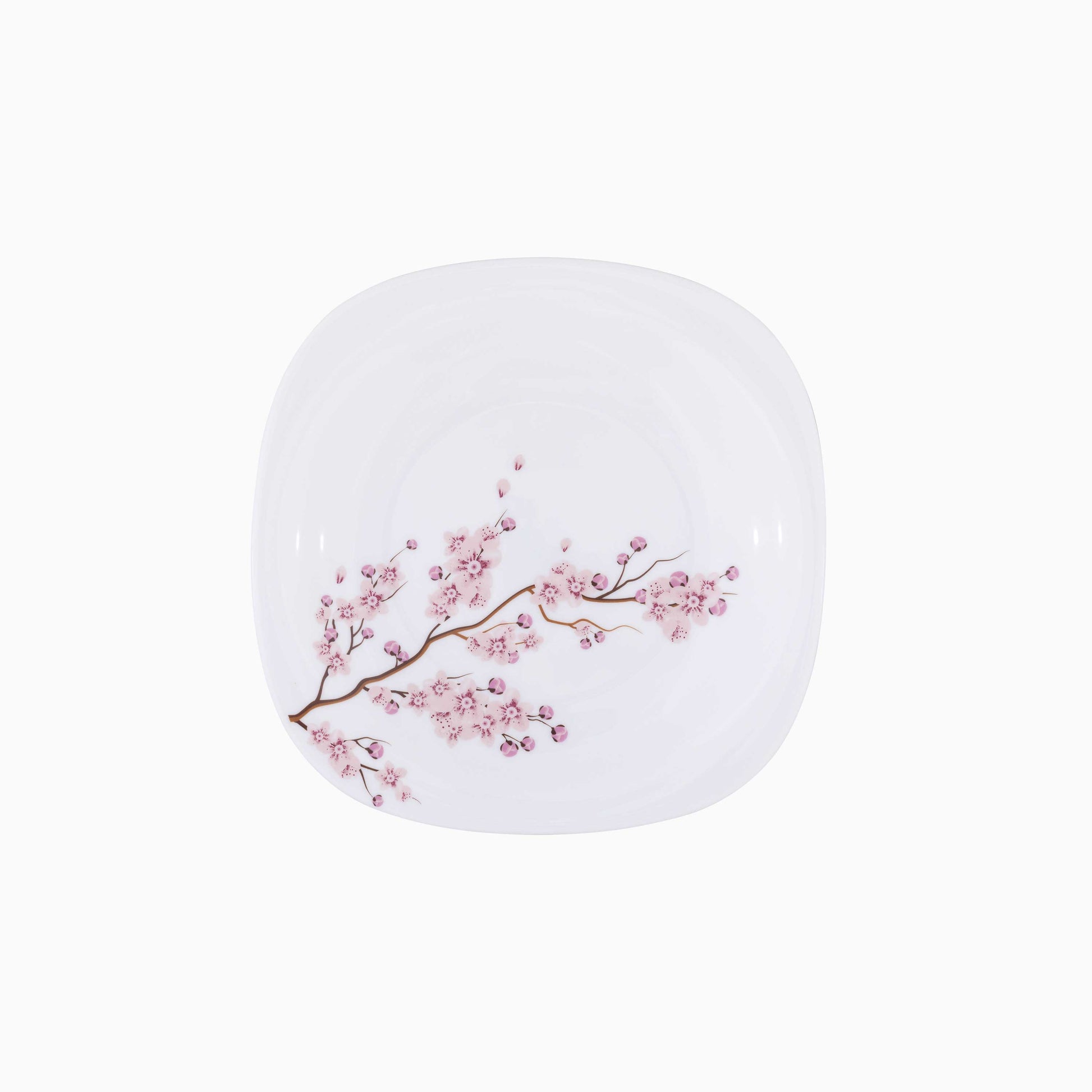 White dessert plate with pink floral design on a white background