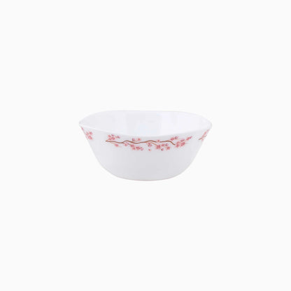 White opal bowl with pink floral design on a white background