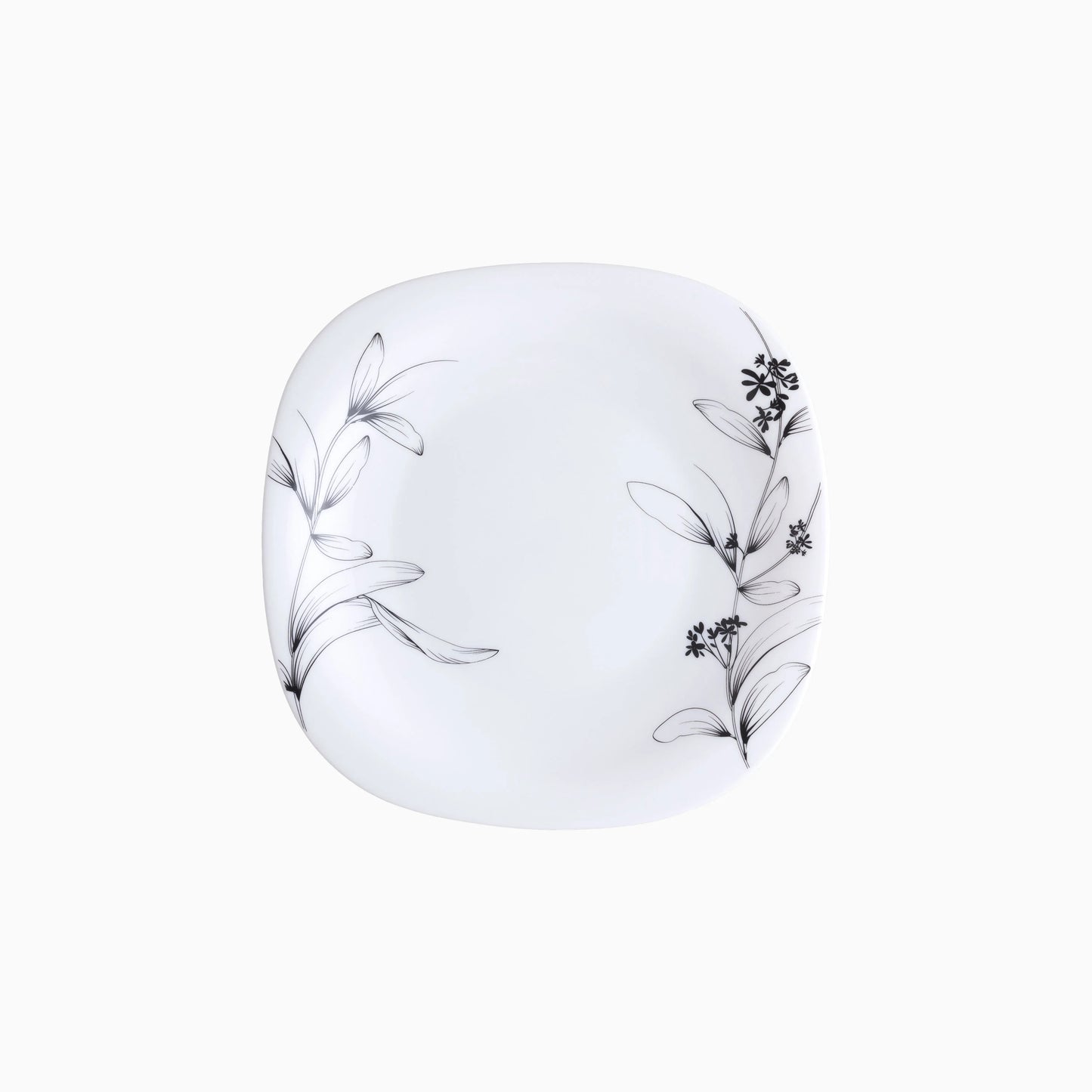 White plate with black floral patterns on a white background