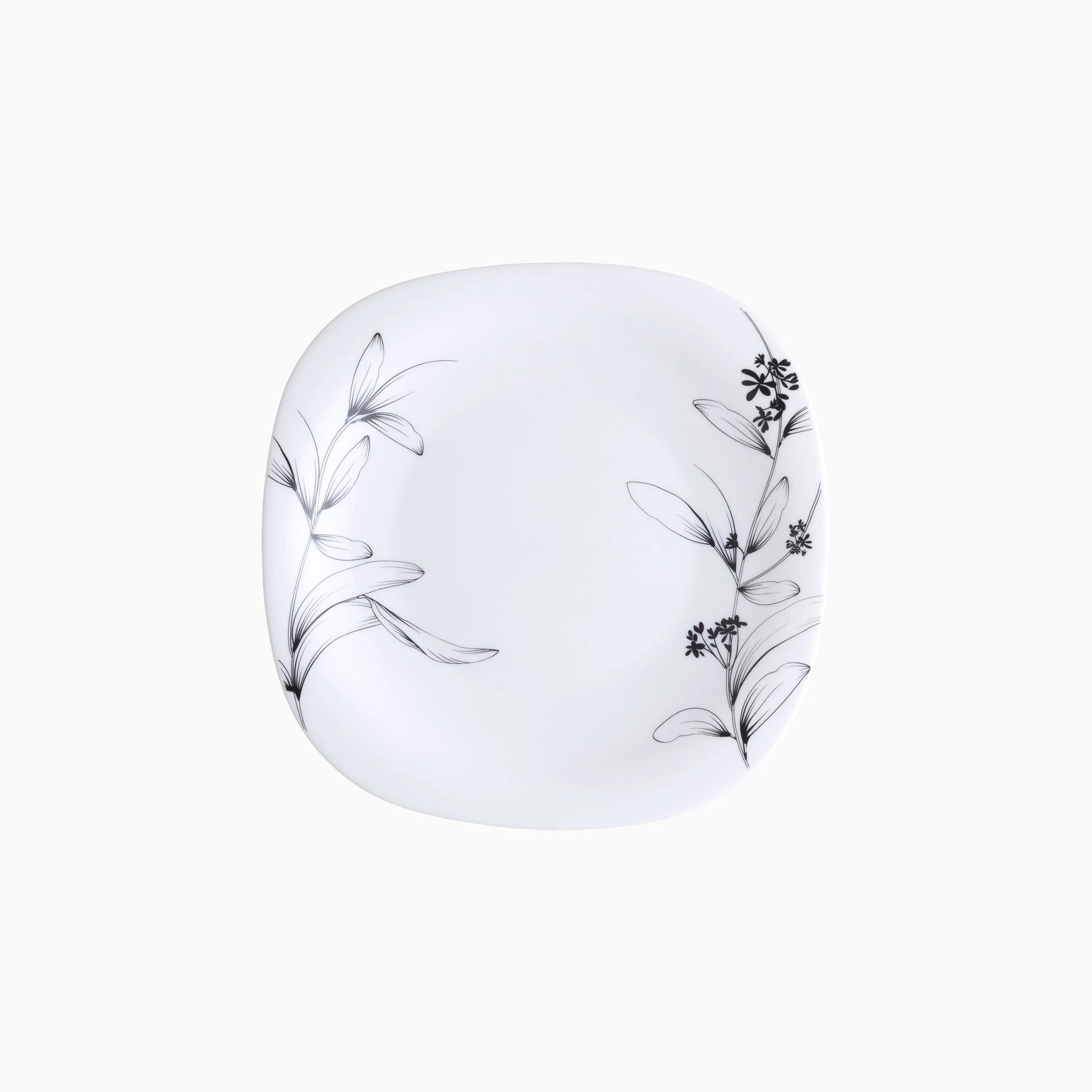 White plate with black floral patterns on a white background