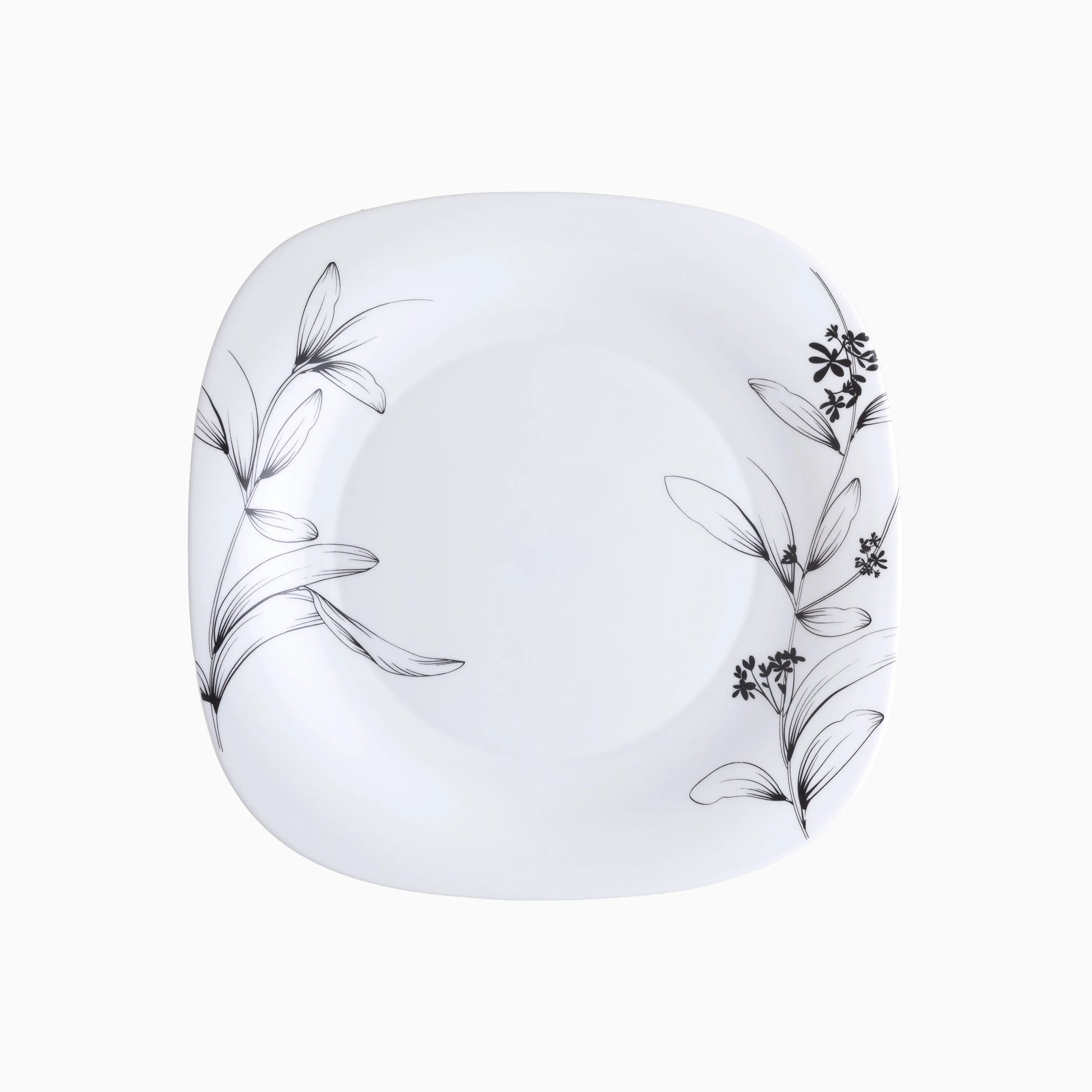 White plate with black floral patterns on a white background